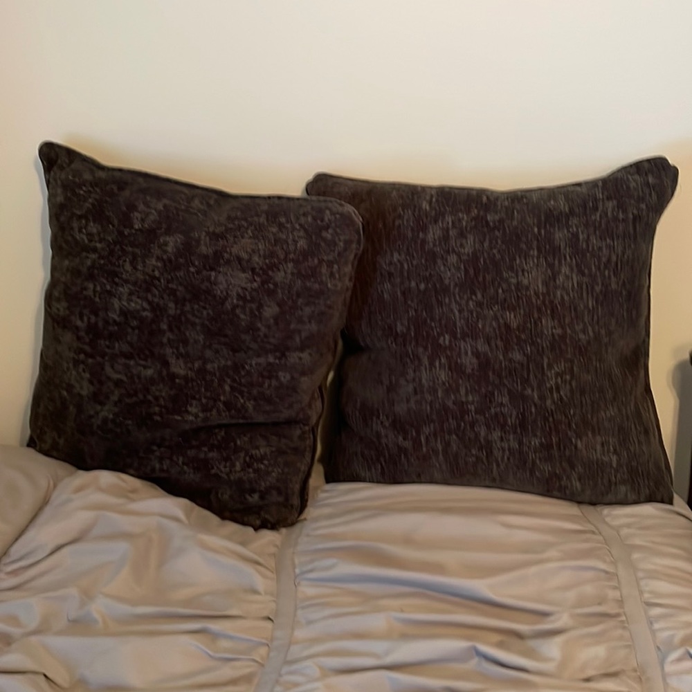 2 dark grey throw pillows